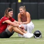 Trevor Lawrence talks with wife