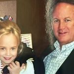 Close-up of JonBenet Ramsey and John Ramsey together and smiling