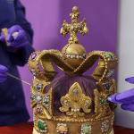 Cadbury World chocolatiers add the finishing touches to a 45cm tall chocolate replica of St Edward’s Crown, which was used at the coronation of King Charles III