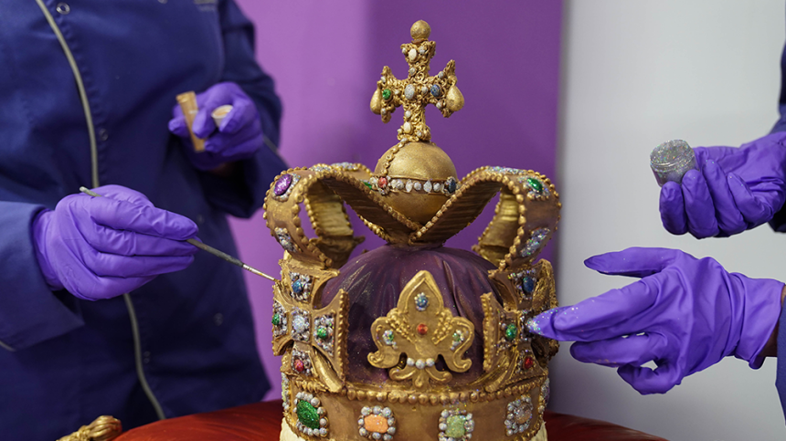 Cadbury World chocolatiers add the finishing touches to a 45cm tall chocolate replica of St Edward’s Crown, which was used at the coronation of King Charles III