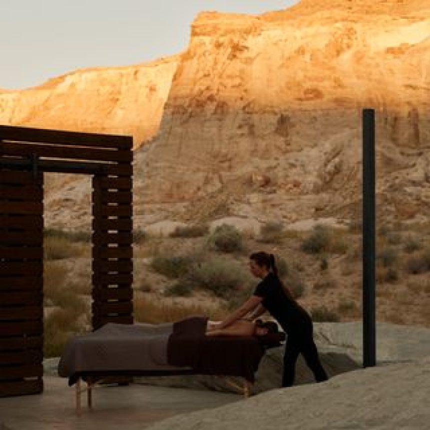 A woman receives a massage in an open-air spa.