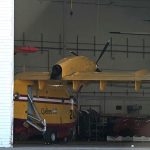 The Canadian Super Scooper which collided with a drone sits in a maintenance hangar at Van Nuys Airport