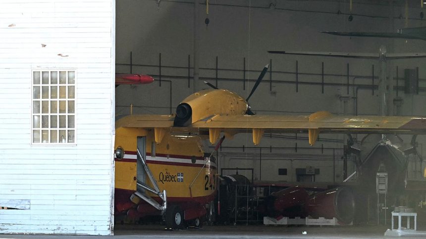 The Canadian Super Scooper which collided with a drone sits in a maintenance hangar at Van Nuys Airport