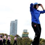 Afghanistan Women´s XI player prepares to take to the field during the cricket match between Afghanistan Women´s XI and Cricket Without Borders XI at Junction Oval in Melbourne on January 30, 2025. — AFP