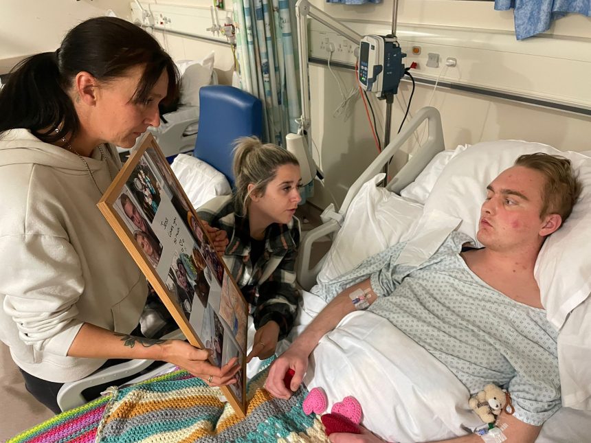 Martin in hospital with his mother, Lyndsey, and his girlfriend, Jess