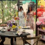 Meghan Markle in windowlined outdoor structure in garden with Mindy Kaling balloons table set for dining