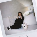 Michelle Keegan cuddled up on the sofa with her dog