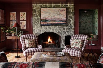 Image may contain Fireplace Indoors Home Decor Hearth Chair Furniture Architecture Building Living Room and Room