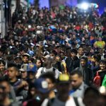 Migrants from a caravan in Tapachula, Chiapas state, Mexico, march while heading to the US border