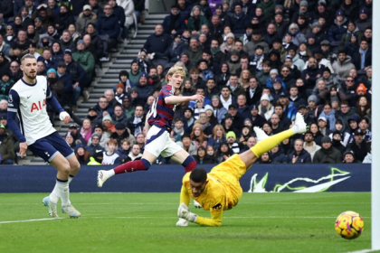 Newcastle United's Anthony Gordon scores their first goal past Tottenham Hotspur's Brandon Austin. Photo: Reuters