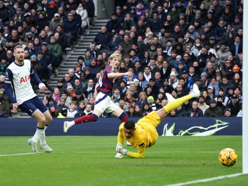 Newcastle United's Anthony Gordon scores their first goal past Tottenham Hotspur's Brandon Austin. Photo: Reuters