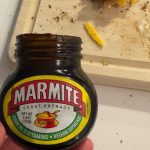 A photo of an open jar of Marmite