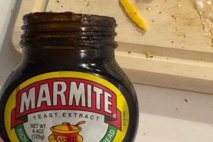 A photo of an open jar of Marmite