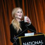 Image may contain Nicole Kidman Crowd Person Adult Audience Electrical Device Microphone Beverage Milk and Speech