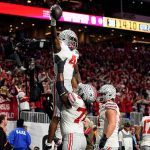 Jeremiah Smith lifted after scoring touchdown