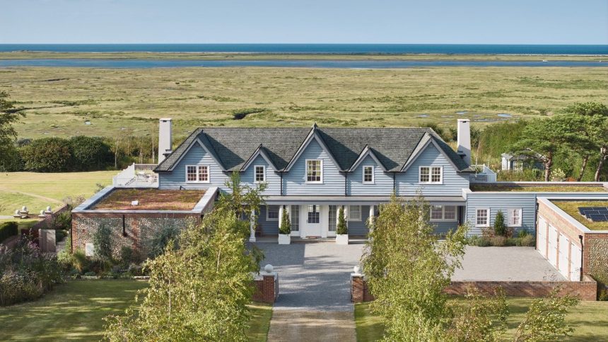 Image may contain Outdoors Architecture Building Housing Plant House Aerial View and Driveway