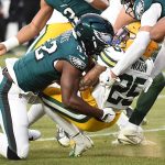 Packers players gets tackled