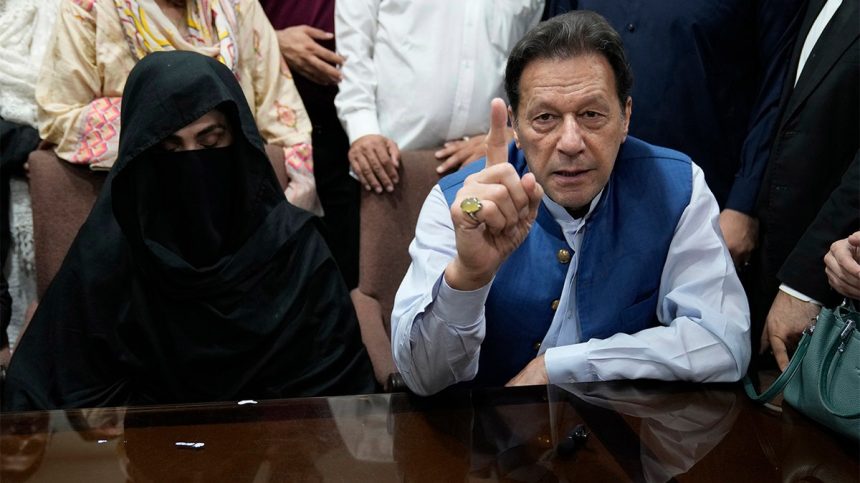 Former Prime Minister of Pakistan Imran Khan and his wife speaking with the media.