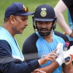 Indias Rohit Sharma chats with then team coach Ravi Shastri during a training session at the MCG in Melbourne on January 2, 2021. — AFP