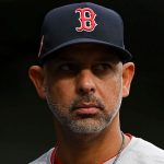 Boston Red Sox manager Alex Cora looks on from dugout