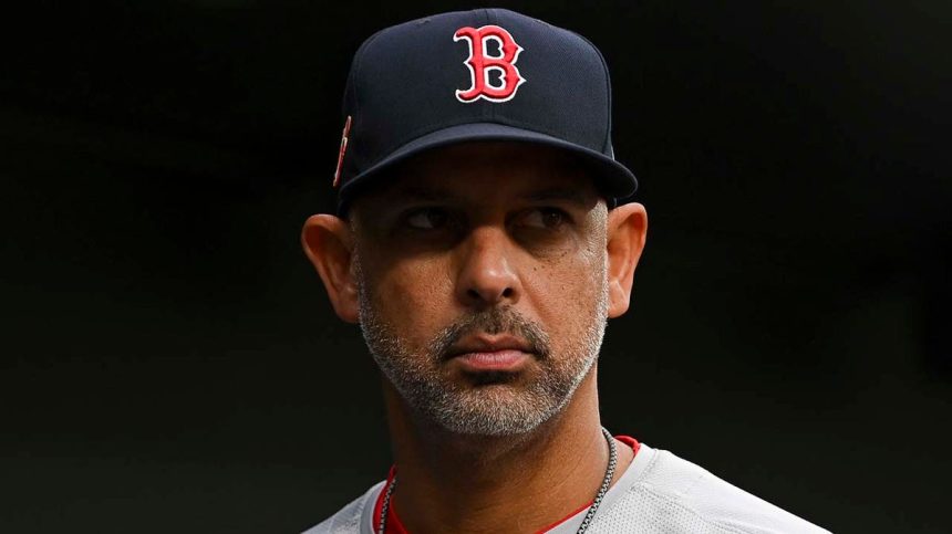 Boston Red Sox manager Alex Cora looks on from dugout