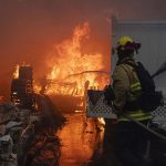 Firefighters in the Palisades at a home