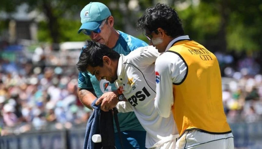 Pakistan´s Saim Ayub (centre) assisted off the field after being injured during the first day of the second Test against South Africa on January 3, 2025. — AFP