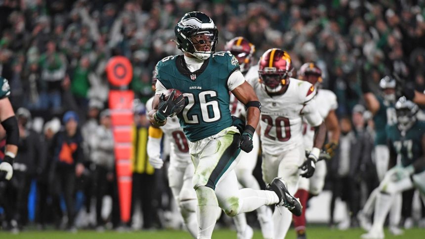 Nov 14, 2024; Philadelphia, Pennsylvania, USA; Philadelphia Eagles running back Saquon Barkley (26) runs past Washington Commanders defenders on way to a 39-yard touchdown during the fourth quarter against the Washington Commanders at Lincoln Financial Field. 