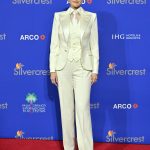 Image may contain Selena Gomez Clothing Formal Wear Suit Person Standing Fashion Adult and Coat