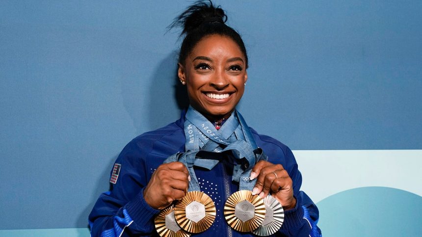 Simone Biles with her medals