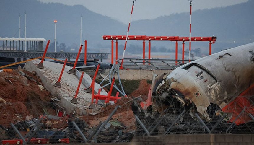 The wreckage of the Jeju Air aircraft that went off the runway and crashed at Muan International Airport lies near a concrete structure it crashed into, in Muan, South Korea, December 30, 2024. — Reuters