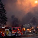 Thousands Flee From Uncontrolled Wildfires Burning Near LA