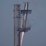 SpaceX's mega rocket Starship booster returns to the launch pad during a test flight from Starbase in Boca Chica, Texas, Thursday, Jan. 16, 2025. (AP Photo/Eric Gay)