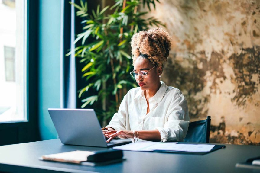 The 10 Best Desk Exercises to Do While Working, According to Personal Trainers