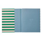 A stripy notebook with nostalgic colors.