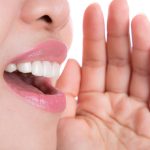 Close up of young woman shouting something