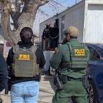 Officers from Homeland Security and the FBI conduct immigration enforcement in El Paso, Texas