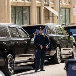 An NYPD officer stands outside parked vehicles relating to the United Nations General Assembly in midtown Manhattan on Wednesday, Sept. 20, 2023.