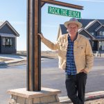 Ty Pennington under Rock the Block street sign