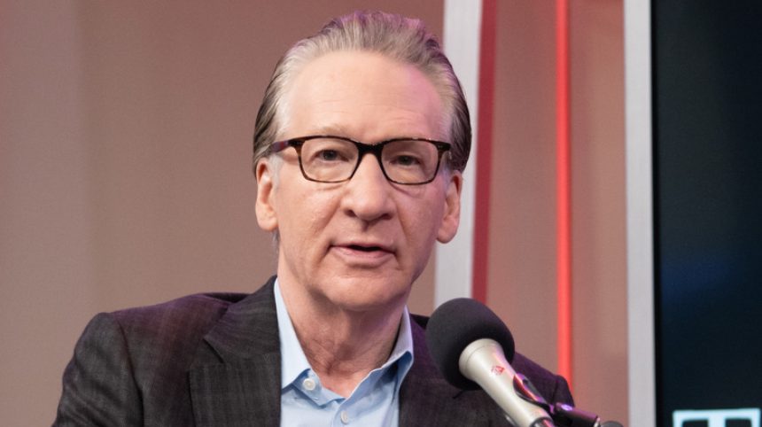 Bill Maher speaking into a microphone