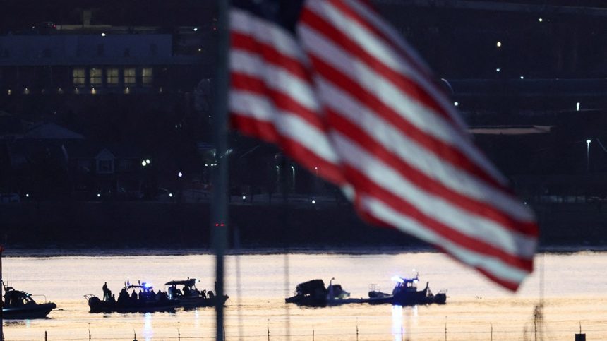 Rescuers work on the Potomac River in Washington DC after a tragic plane crash