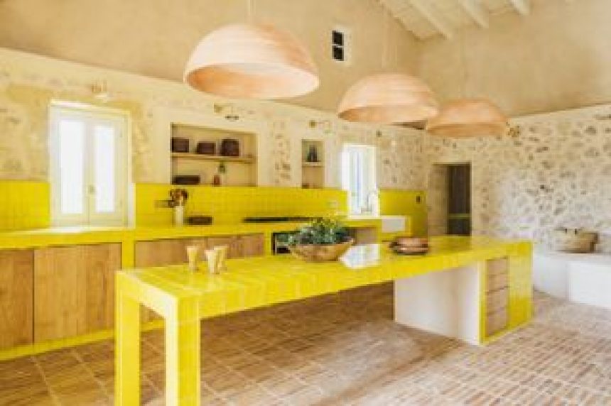 A Spanish Farmhouse Was in Ruins. Bright Yellow Brought It Back to Life.