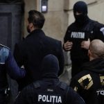 Tate brothers are brought in by police officers at the Bucharest Court of Appeal