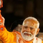 Indias Prime Minister Narendra Modi shows the Bharatiya Janata Party (BJP) symbol during a roadshow as part of an election campaign, in Varanasi, India, May 13, 2024. — Reuters