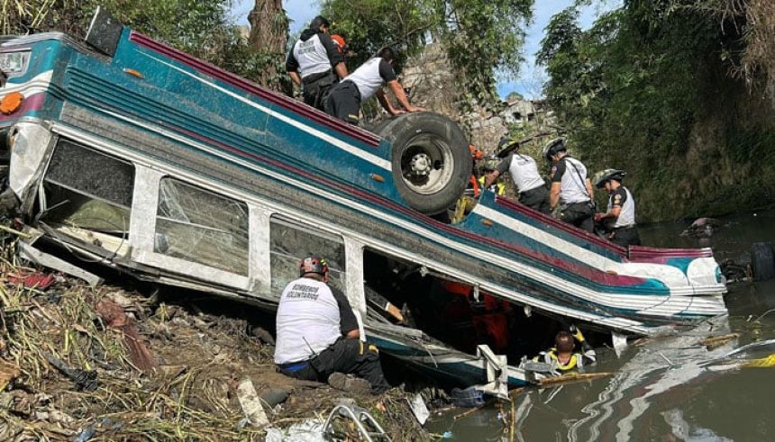 Volunteer firefighters work at the scene of an accident in which a bus fell down a ravine in Guatemala City on February 10, 2025. — AFP