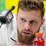 Harrison Butker talks to reporters