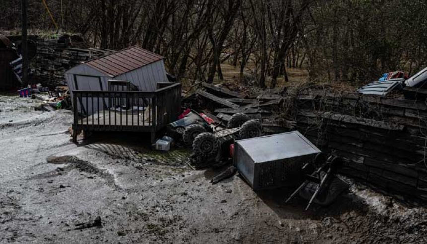 A broken flood wall where mud and floodwaters poured through is seen at Ramsey Mobile Home Park following rain storms that caused flooding on February 17, 2025 in Pikeville, Kentucky. — AFP