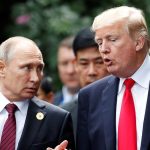 U.S. President Donald Trump and Russia's President Vladimir Putin talk during the family photo session at the APEC Summit in Danang, Vietnam November 11, 2017. REUTERS/Jorge Silva - RC1B1EDB0E40