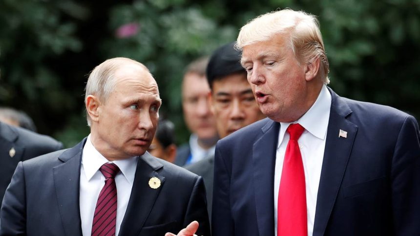 U.S. President Donald Trump and Russia's President Vladimir Putin talk during the family photo session at the APEC Summit in Danang, Vietnam November 11, 2017. REUTERS/Jorge Silva - RC1B1EDB0E40