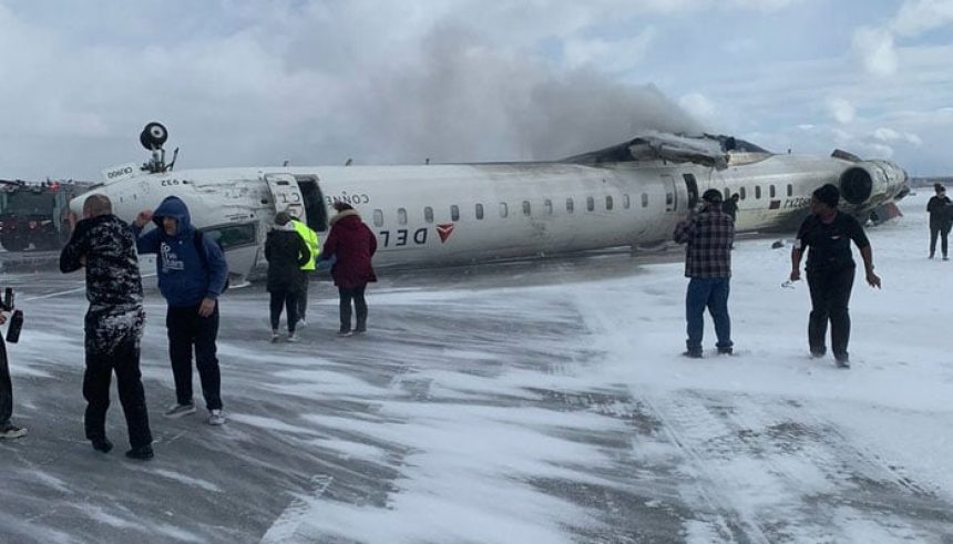 A Delta Airlines plane is seen flipped at the Pearson International Airport, Toronto, Canada on February 18, 2025. — X@Huberton